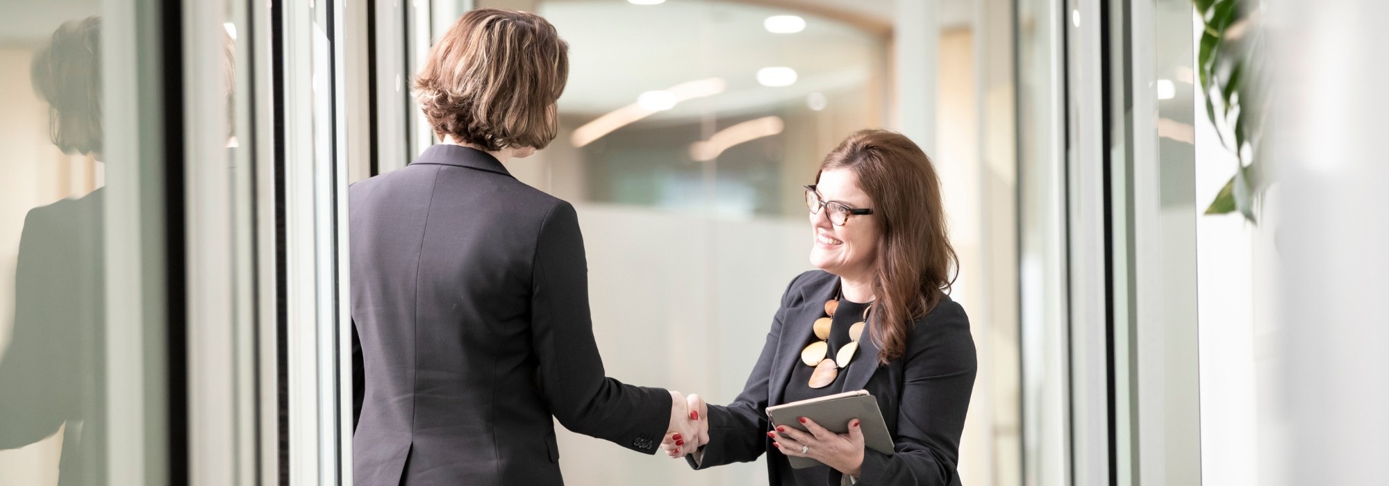 Recruiter shaking hands with client